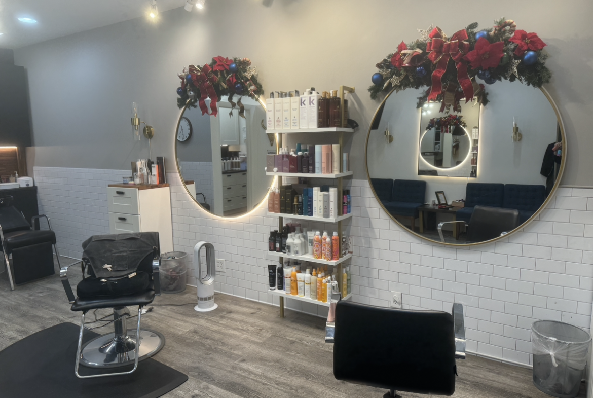 Stylish salon with modern decor and holiday accents.