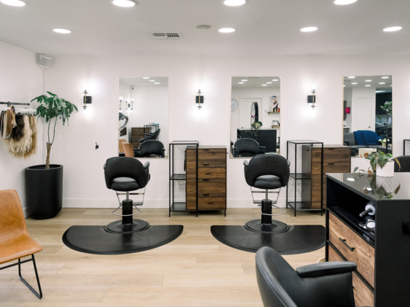Stylish salon with professional hair styling stations and contemporary decor.