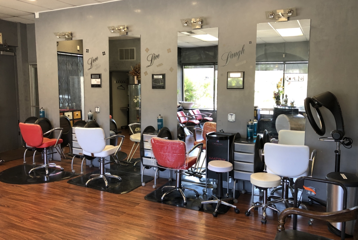 Salons chairs with mirrors in a stylish salon setting for rent or stylist workspace.