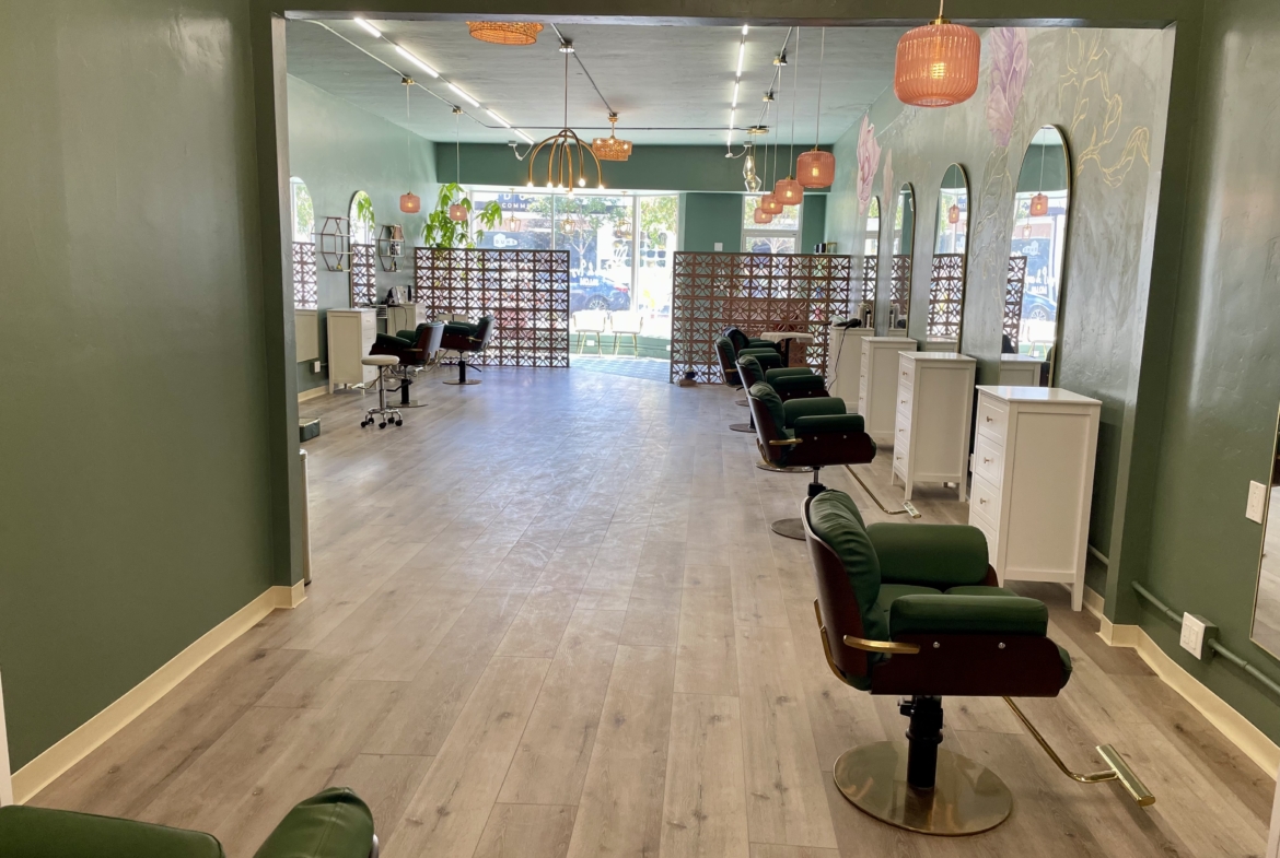 Stylish hair salon with comfortable chairs, mirrors, and a welcoming atmosphere.