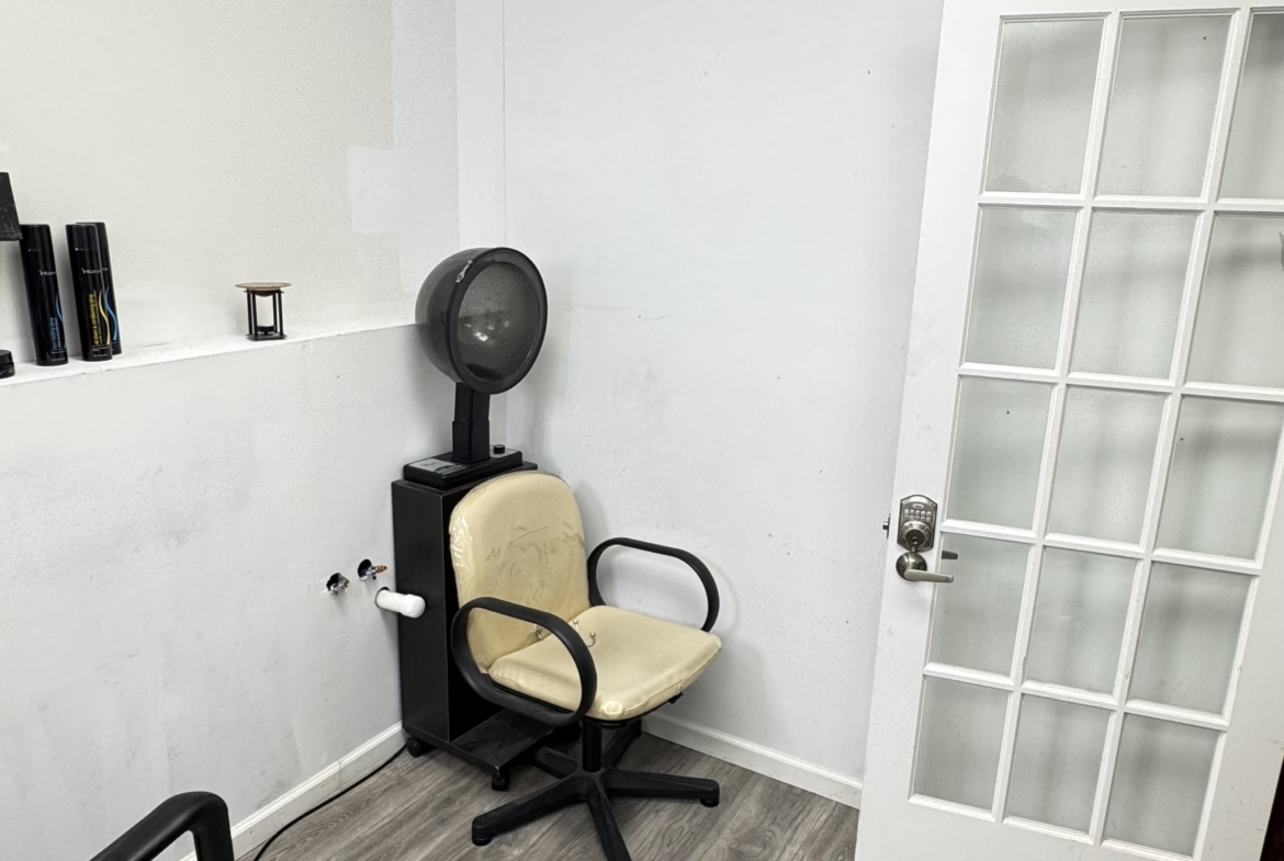 Clean hair salon studio with chairs and hairdryers in rental space.