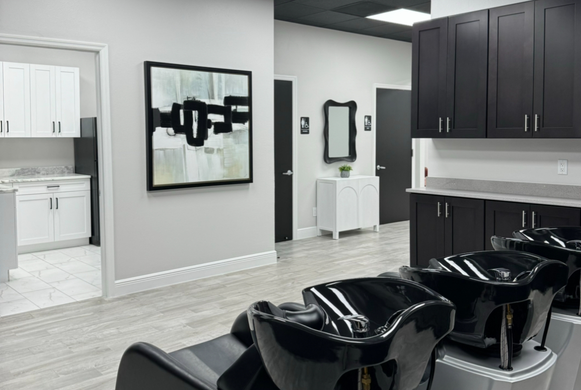Modern hair salon with washbasins, cabinetry, and clean design perfect for rent or leasing.