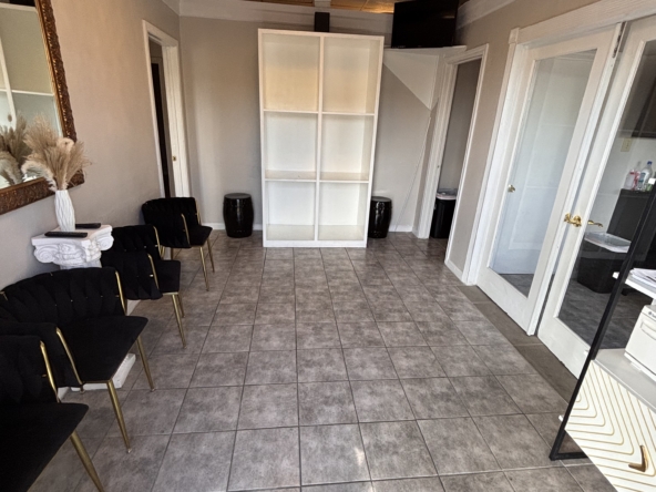 Spacious salon rental with comfortable seating and stylish interior design.