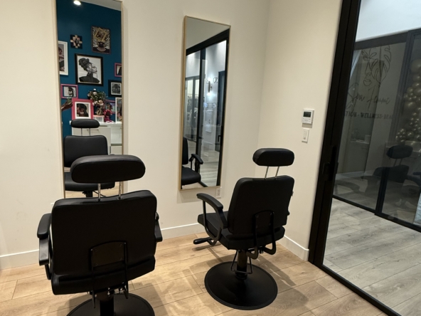 Stylish salon chairs with mirrors in a modern hair studio, perfect for hairstyling and beauty treatments.