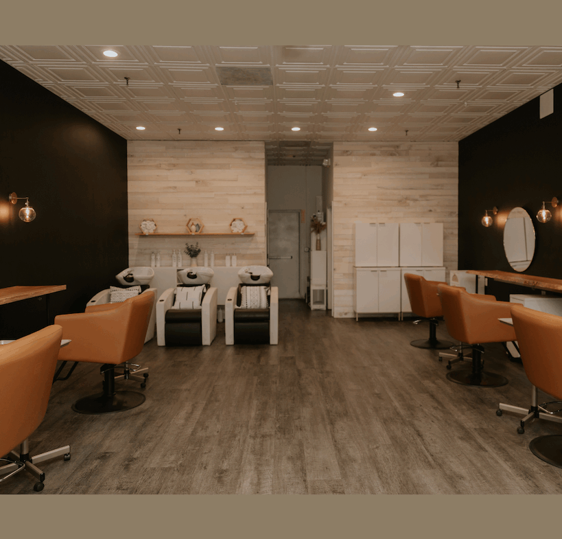 Stylish salon with relaxing chairs, wash stations, and contemporary decor for rental.
