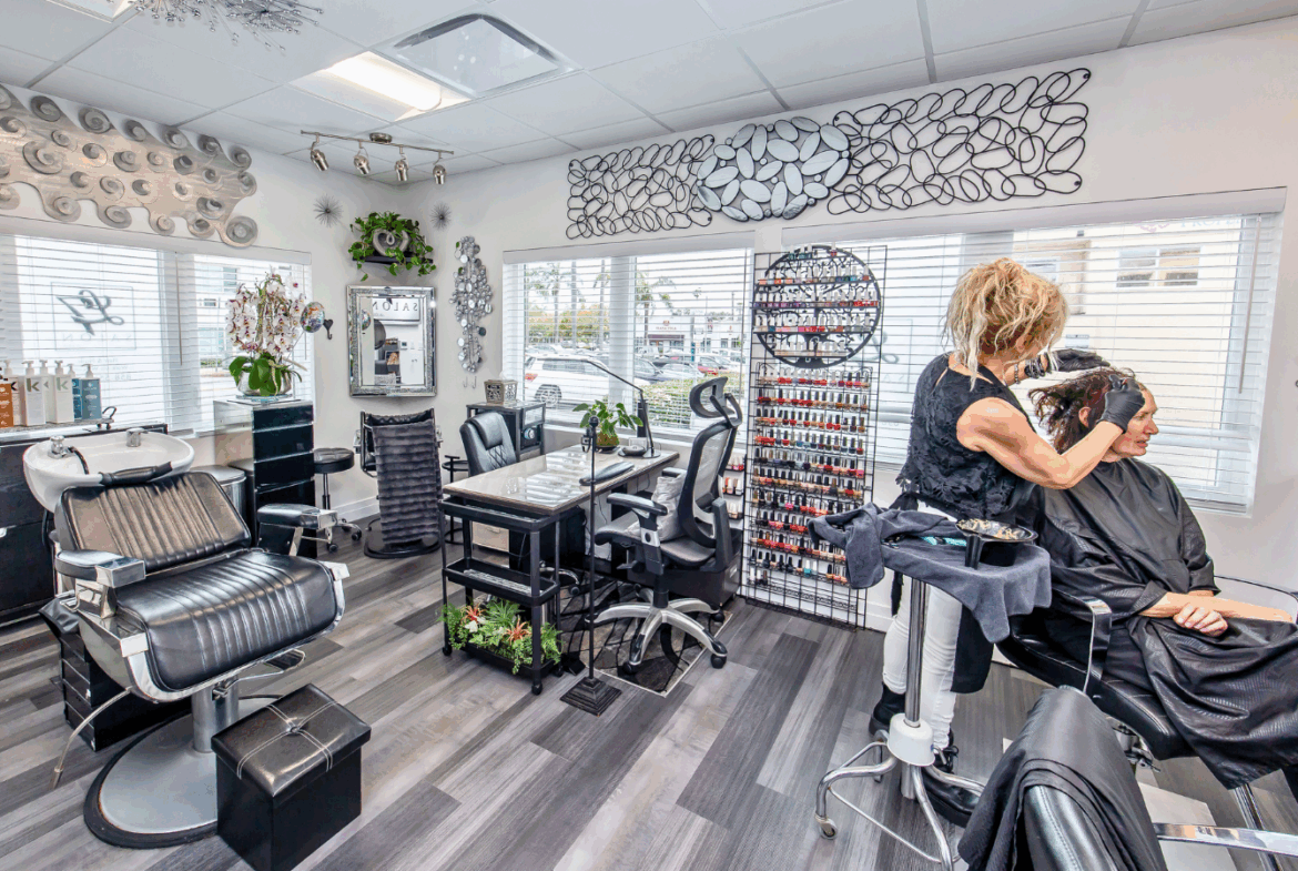 Bright, stylish salon with professional hair stylist and ample natural light, ideal for rent.