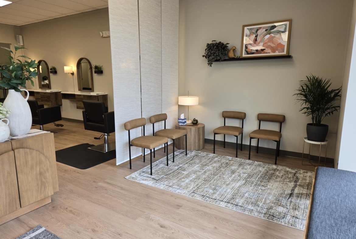 Comfortable salon reception with sitting area and attractive interior design.