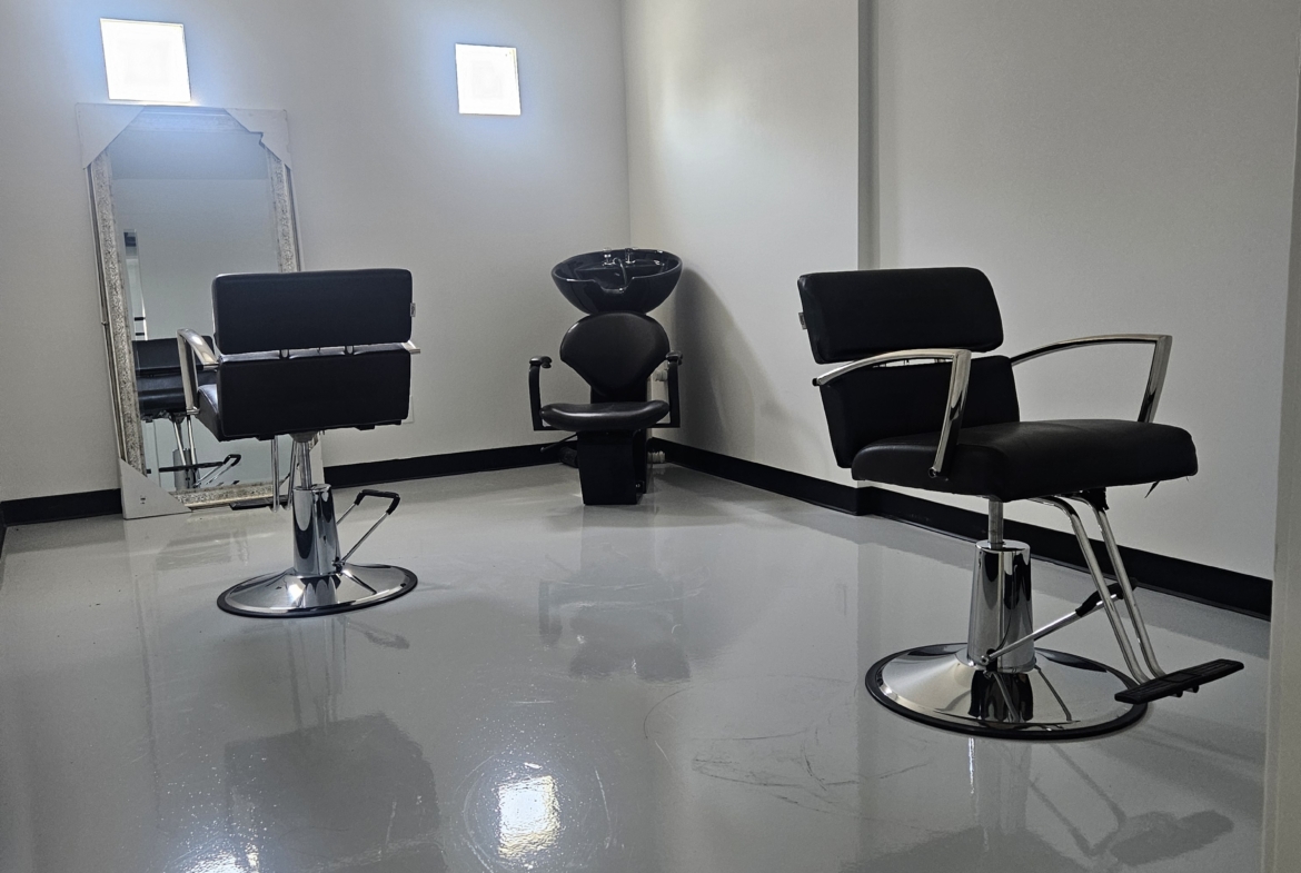 Stylish and clean salon workspace with contemporary furniture and good lighting for beauty services.