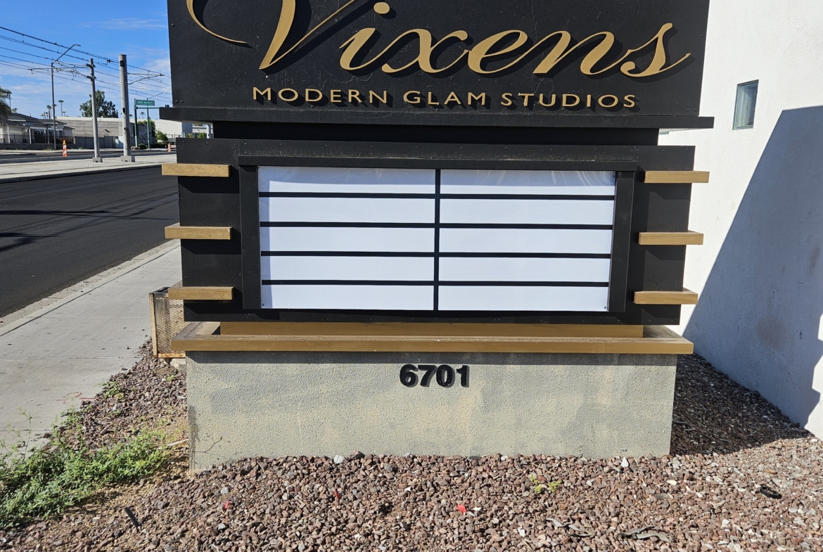 Professional salon sign for Vixens Modern Glam Studios, located at 6701.