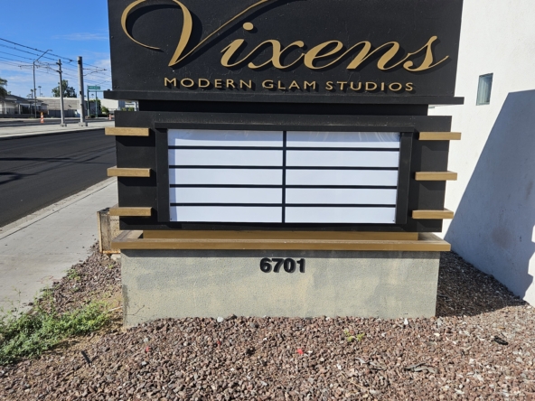 Professional salon sign for Vixens Modern Glam Studios, located at 6701.
