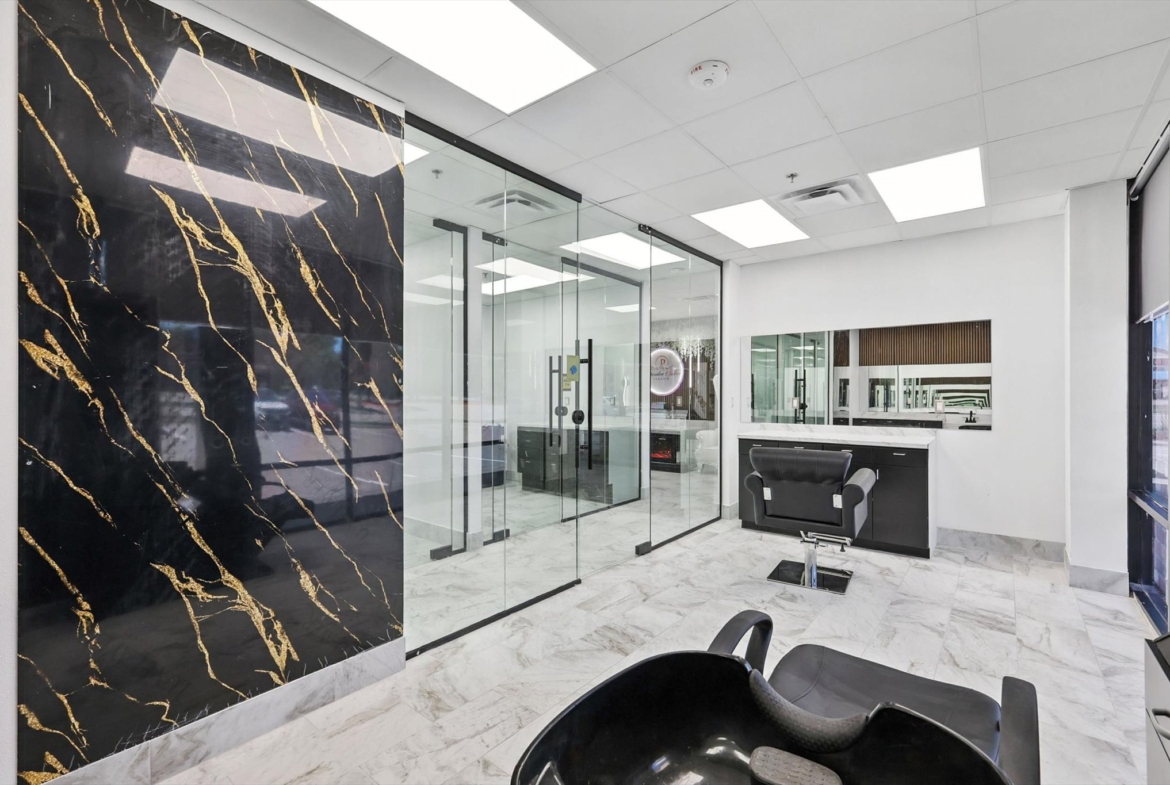 Modern hair salon interior with sleek styling stations and stylish decor.