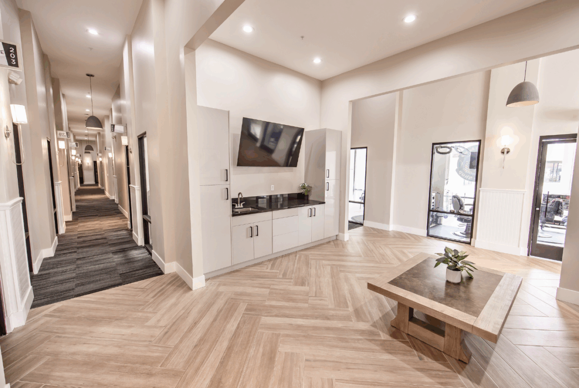 Bright, contemporary salon interior with inviting seating and stylish design perfect for salon rental spaces.