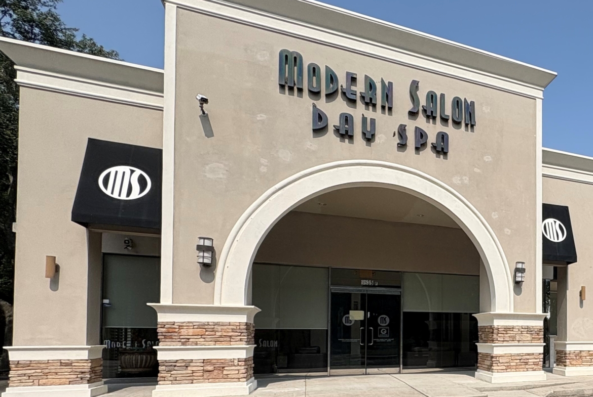 Elegant day spa facade with modern signage, welcoming atmosphere, perfect for salon rentals.