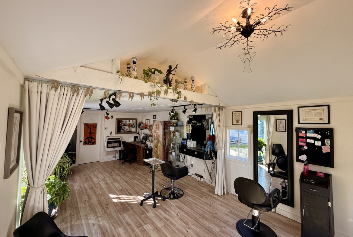 Bright indoor hair salon with styling stations, mirrors, and chairs, perfect for independent beauty professionals.