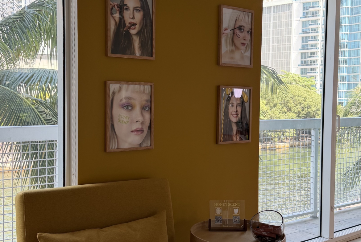 Bright salon interior with large windows, trendy decor, and beauty portraits ideal for salon rental marketing.