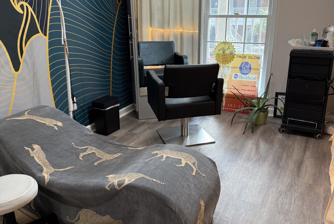 Stylish beauty salon with bright natural light and modern decor.