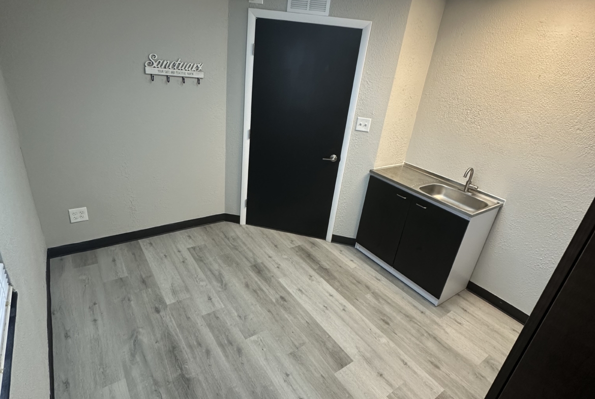 Bright, clean hair salon rental with sink and private room, ideal for beauty professionals.