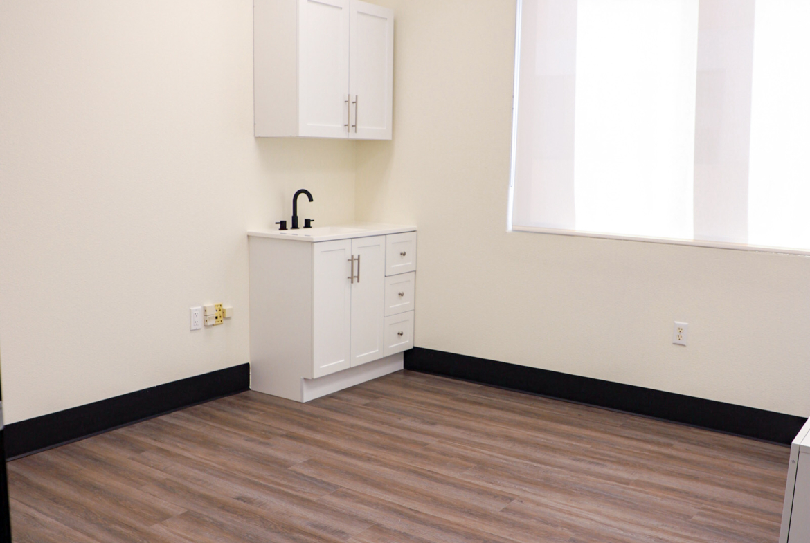 Clean, bright salon rental with kitchenette for beauty professionals.