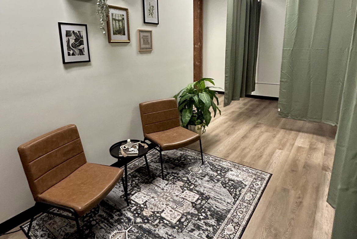 Well-designed salon rent area with cozy seating, modern decor, and privacy curtains for hair and beauty services.