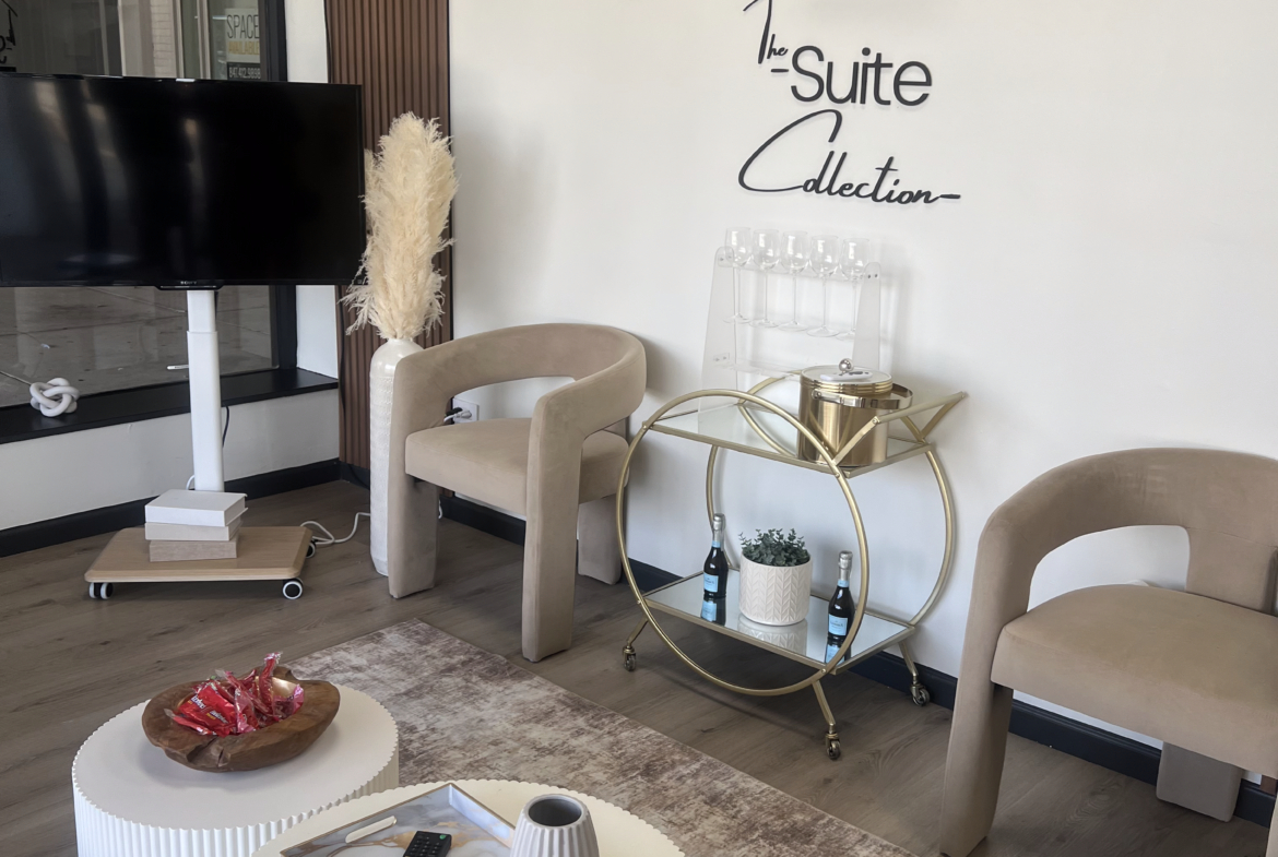 Chic salon waiting area with contemporary furniture, elegant wall decor, and chic accessories.