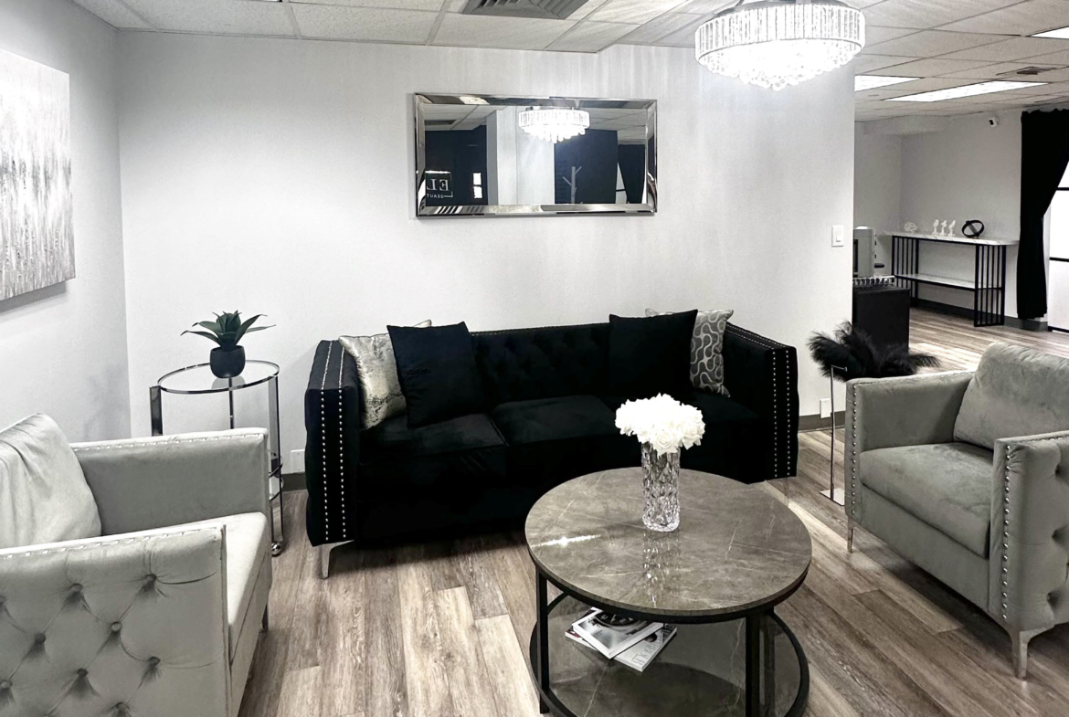 Relaxing salon reception with elegant sofa seating and chic interior design.