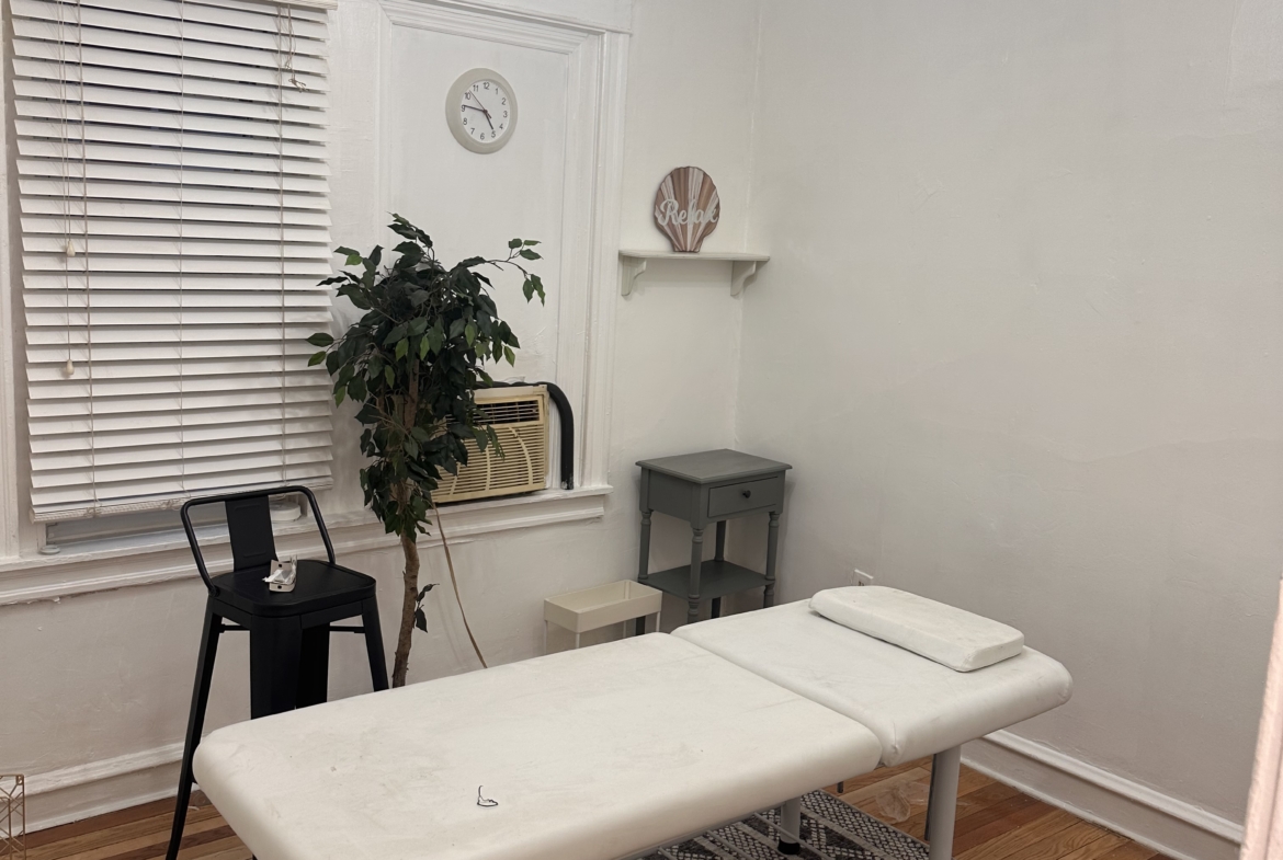 Bright, modern salon rental with comfortable massage or treatment table, perfect for beauty services.