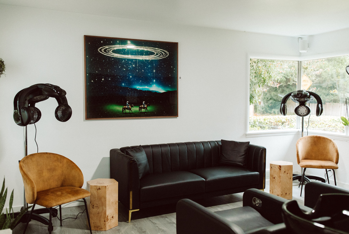 Clean salon lounge with comfortable seating, modern lounge chairs, and professional hair studio ambiance.