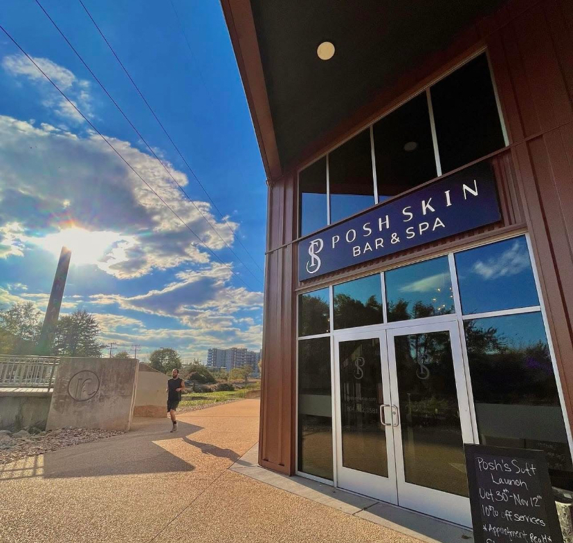 Modern salon with a welcoming bar & spa ambiance outdoors under clear blue skies.
