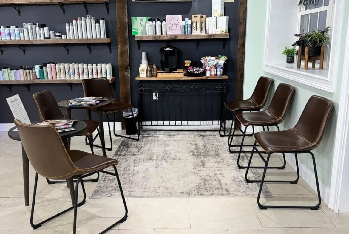 Comfortable salon seating and product shelves for salon professionals seeking rental spaces.