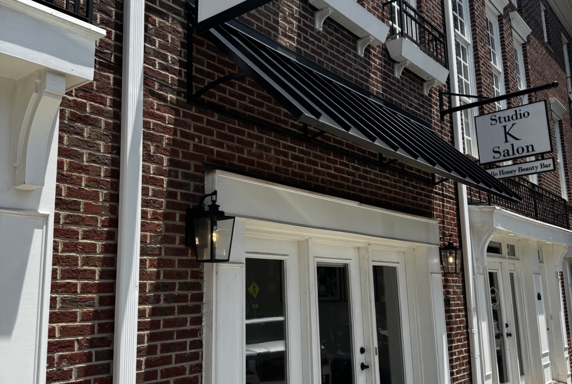 Bright, inviting exterior of a salon with stylish signage and clean storefront design.