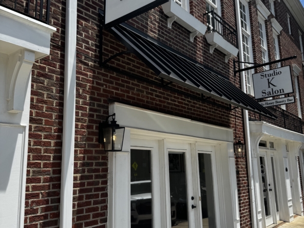 Bright, inviting exterior of a salon with stylish signage and clean storefront design.