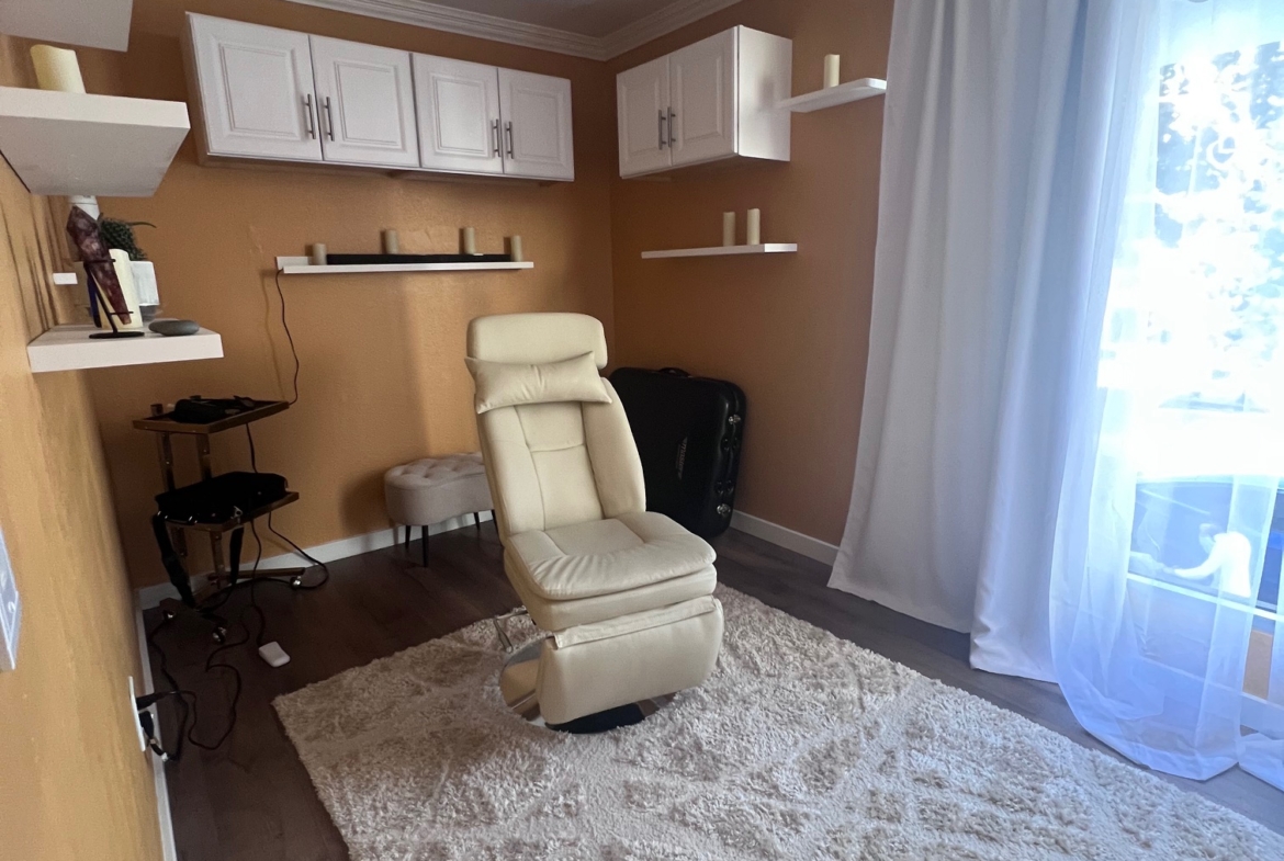 Comfortable salon workspace with chair, storage, and decor, ideal for salon rental or leasing.