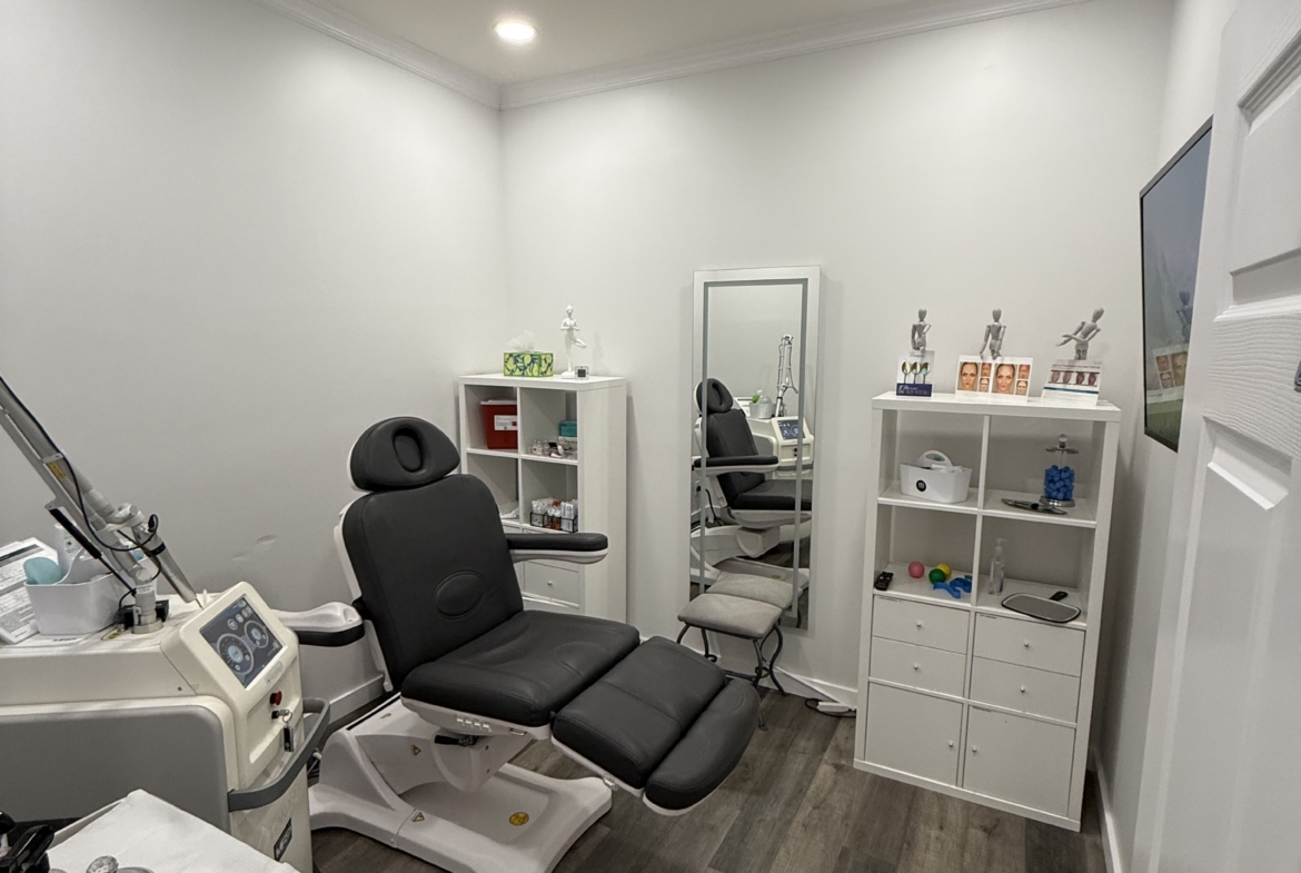 Clean and organized salon room with styling chairs, equipment, and storage cabinets. Perfect for hair, beauty, and skincare professionals.