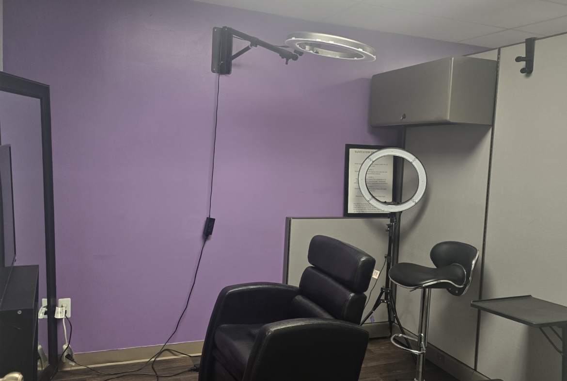 Comfortable salon chair in a professional beauty studio setup.