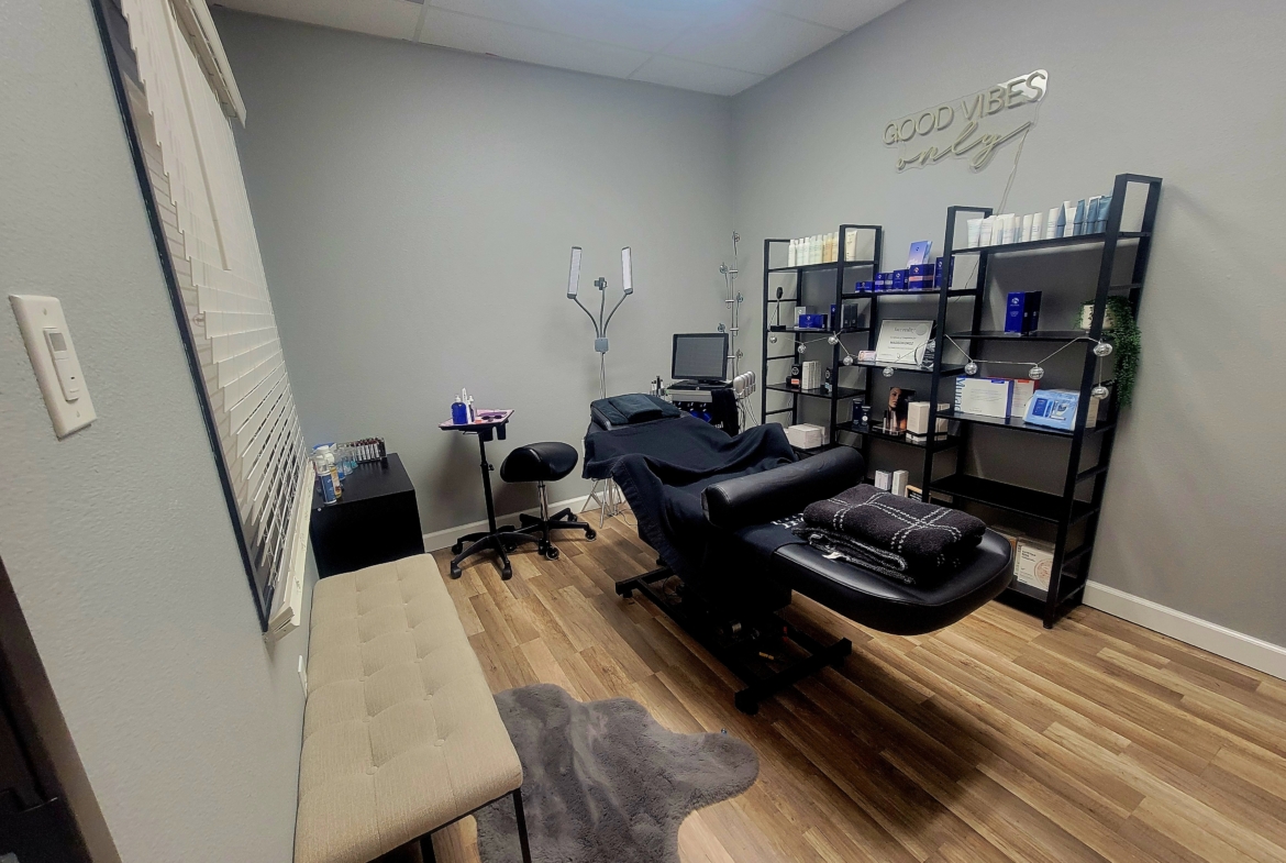 Comfortable skincare treatment room with professional equipment and cozy ambiance.