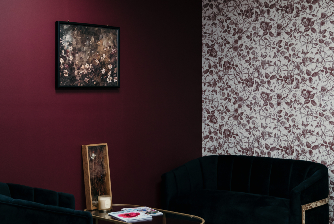 Comfortable salon lounge featuring velvet seating and elegant decor.