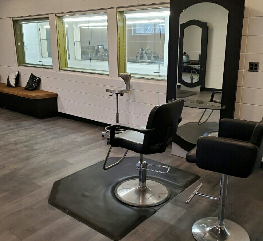 Stylish salon station featuring professional chairs and a large mirror for rent at a salon studio.