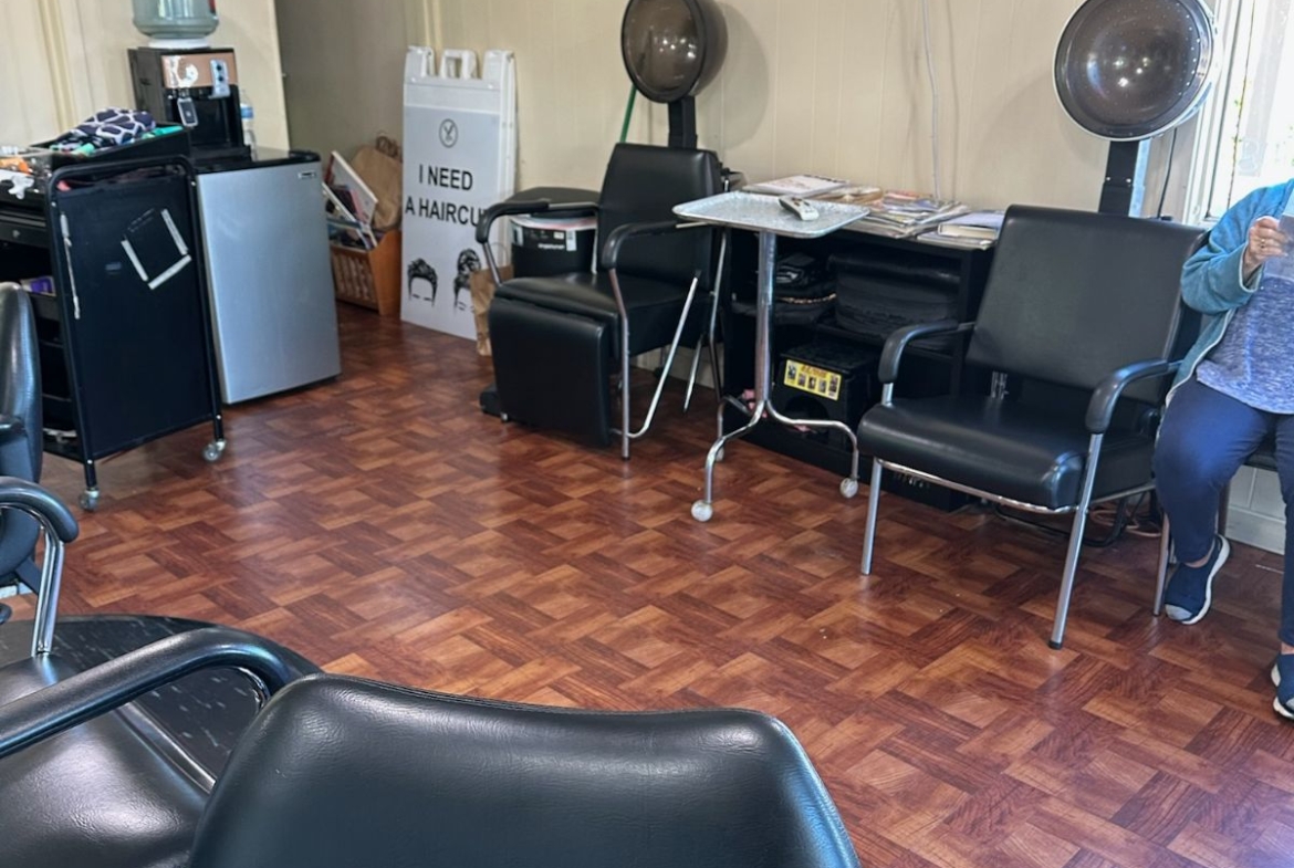 Hair salon with chairs, drying stations, and styling tools for rent.