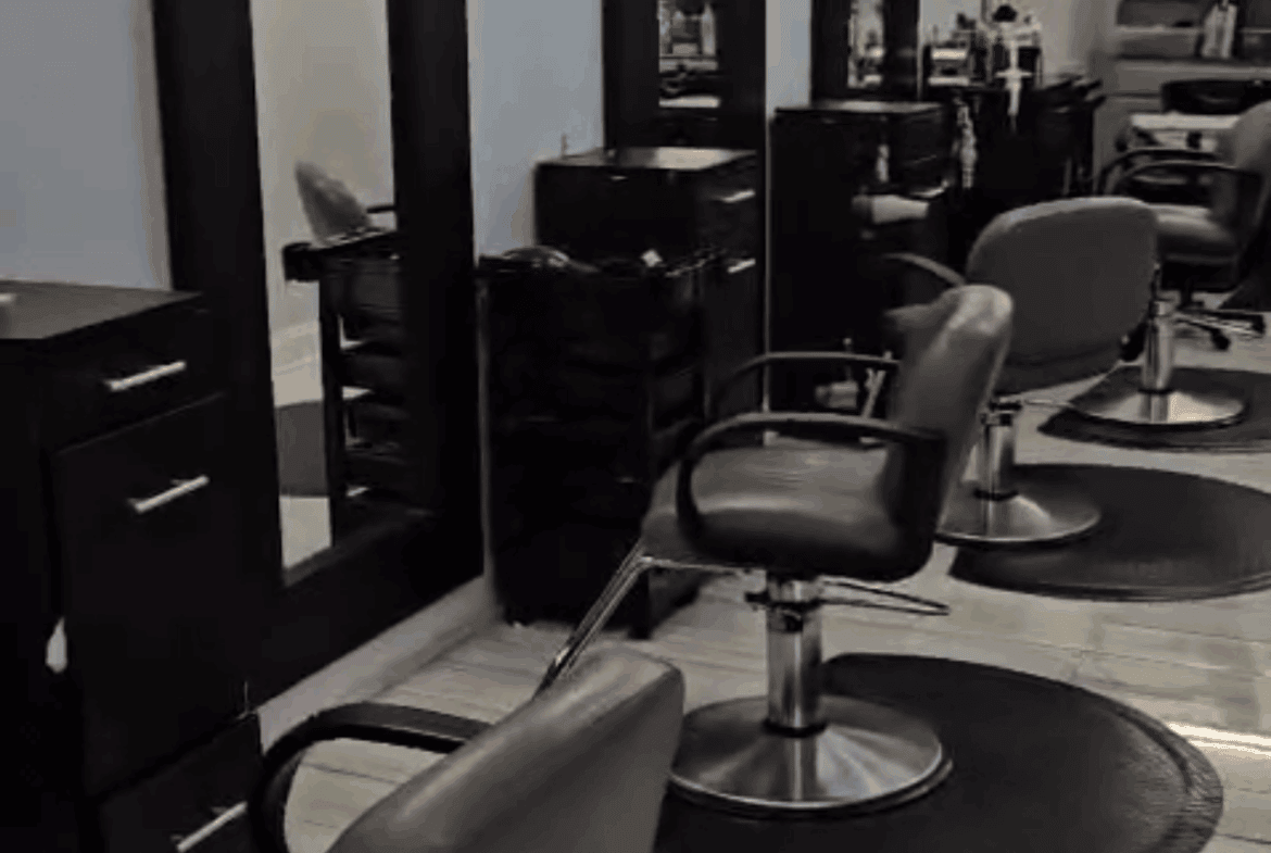 Stylish salon chairs and mirrors in modern salon space for rent.