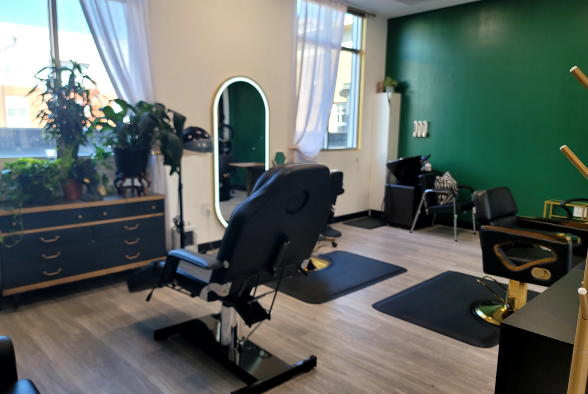 Bright, stylish salon workspace featuring comfortable styling chairs and natural light.