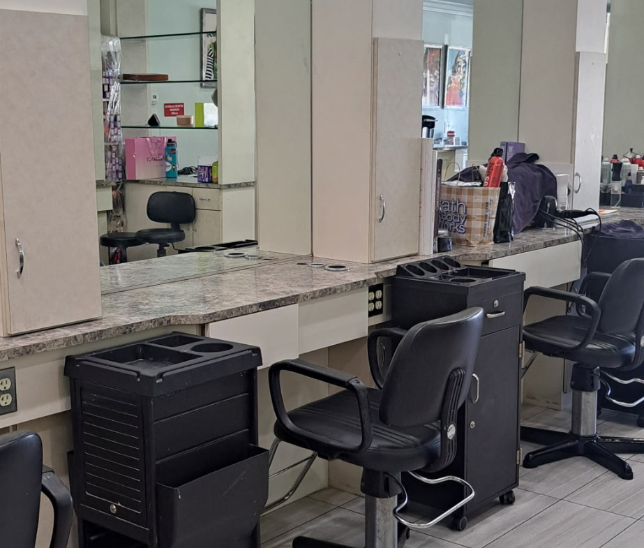 A clean, organized salon station with styling chairs and mirrors for hair services. Perfect for salon rent or leasing.