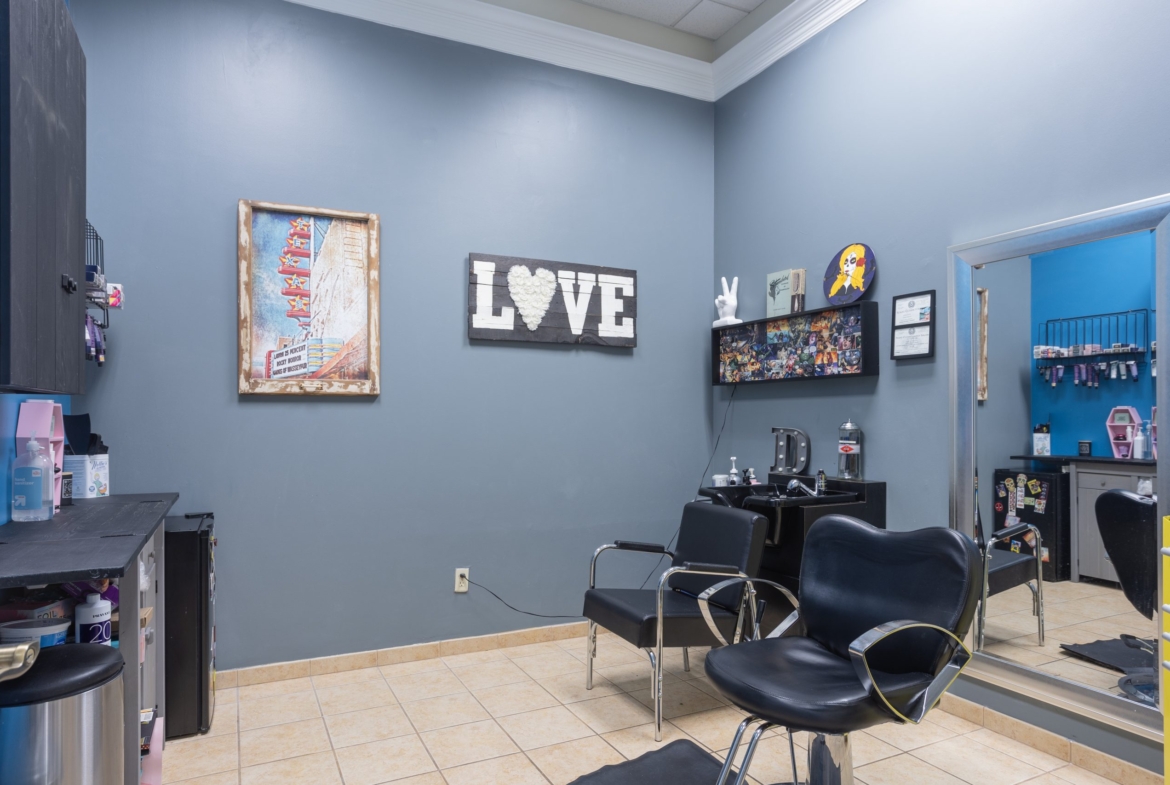 Cute salon interior with chairs, decor, and styling area, ideal for hair and beauty rental spaces.