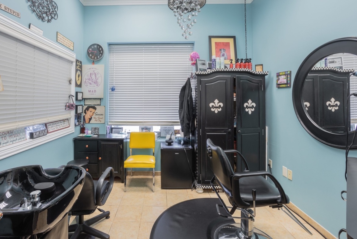 Modern salon workspace with styling chairs, mirror, and equipment for rent by beauty entrepreneurs.