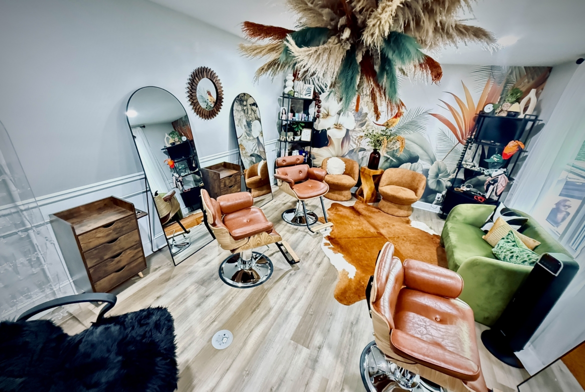 Bright salon with modern chairs, mirrors, and colorful decor creating a welcoming beauty environment.
