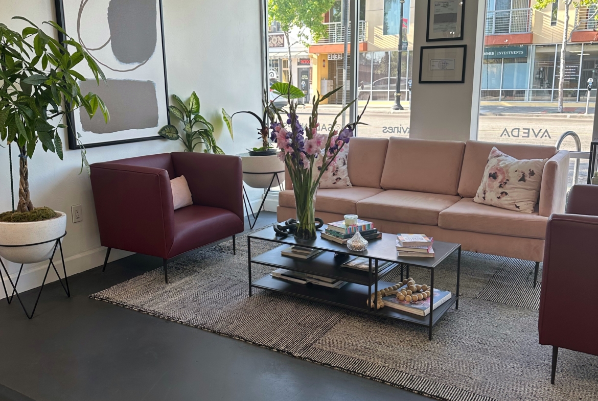 Elegant salon lounge with comfortable seating and contemporary design elements.