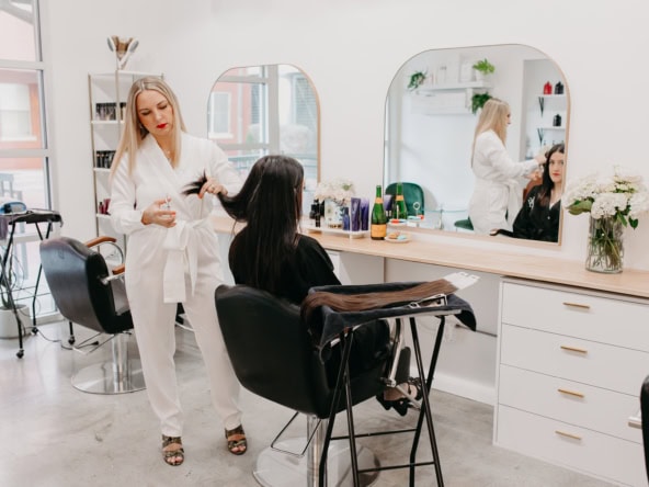 1. Stylish salon interior with hairstylist and client, modern beauty space, Salon Renter.