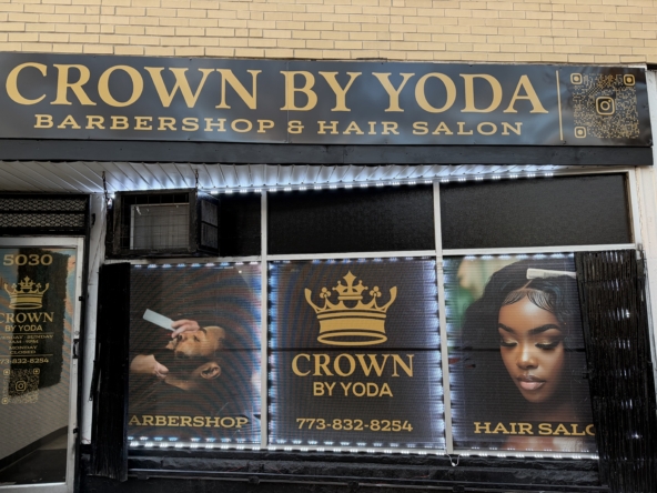 Stylish outdoor sign for Crown by Yoda hair salon and barbershop in bold gold lettering.