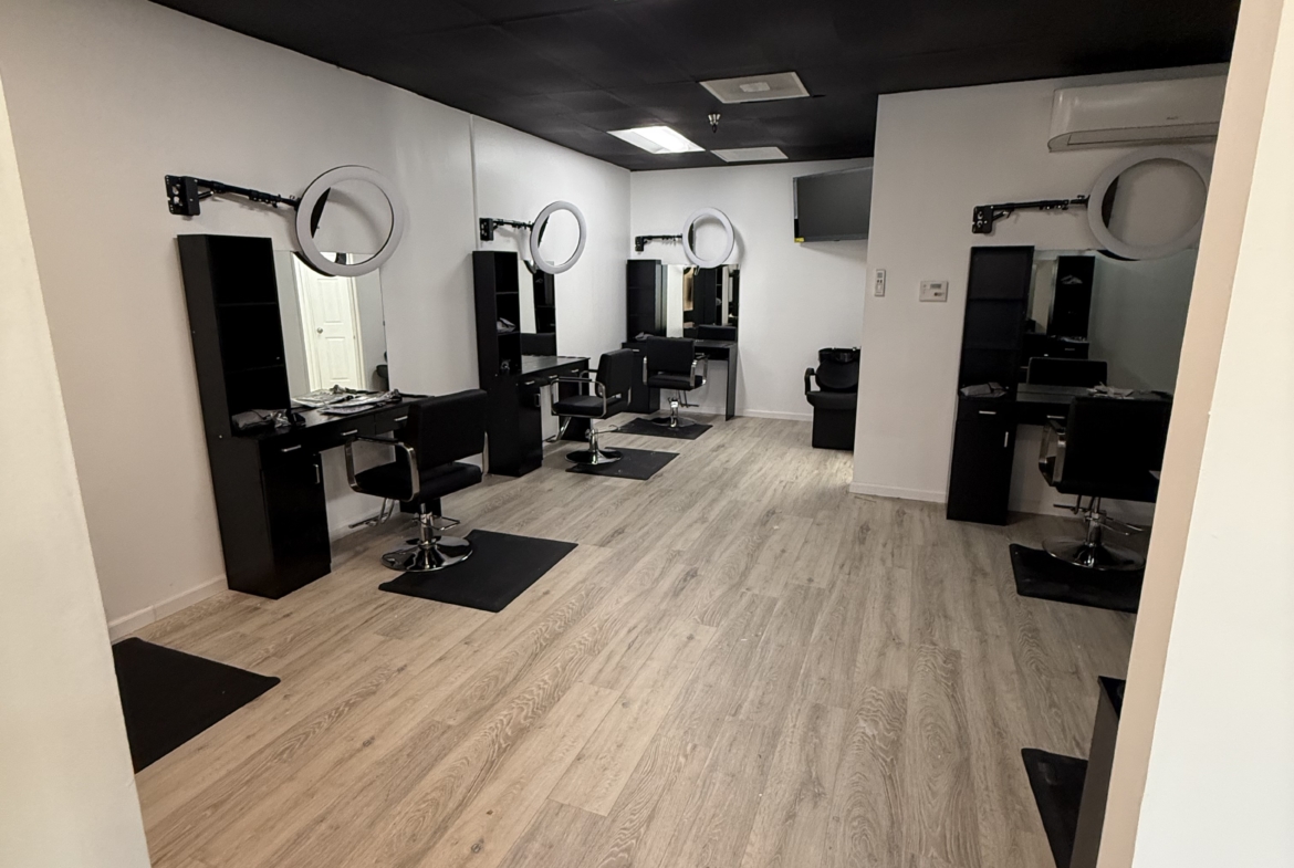 Stylish salon stations with mirrors and chairs, ideal for beauty professionals and entrepreneurs.