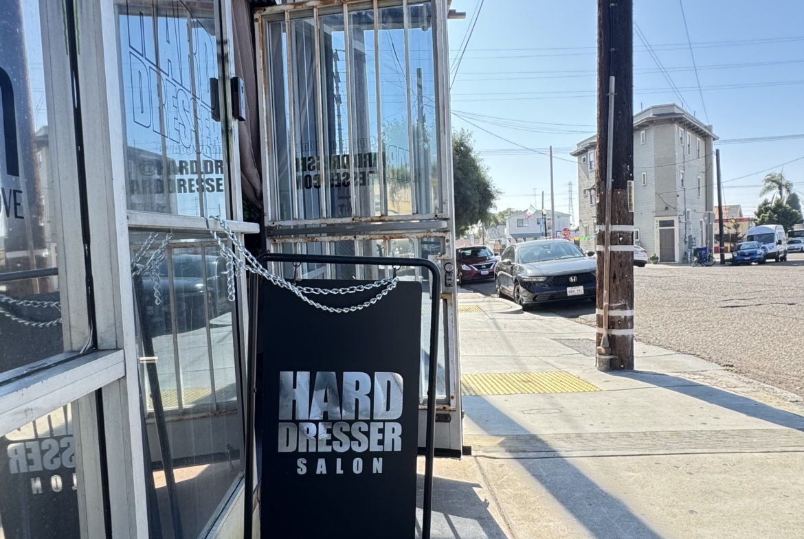 Outdoor salon rental signboard outside hair salon.