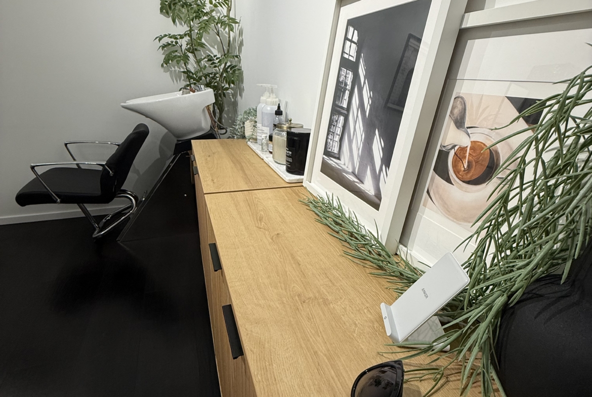 Stylish salon station with decor and essentials in a modern salon rental.